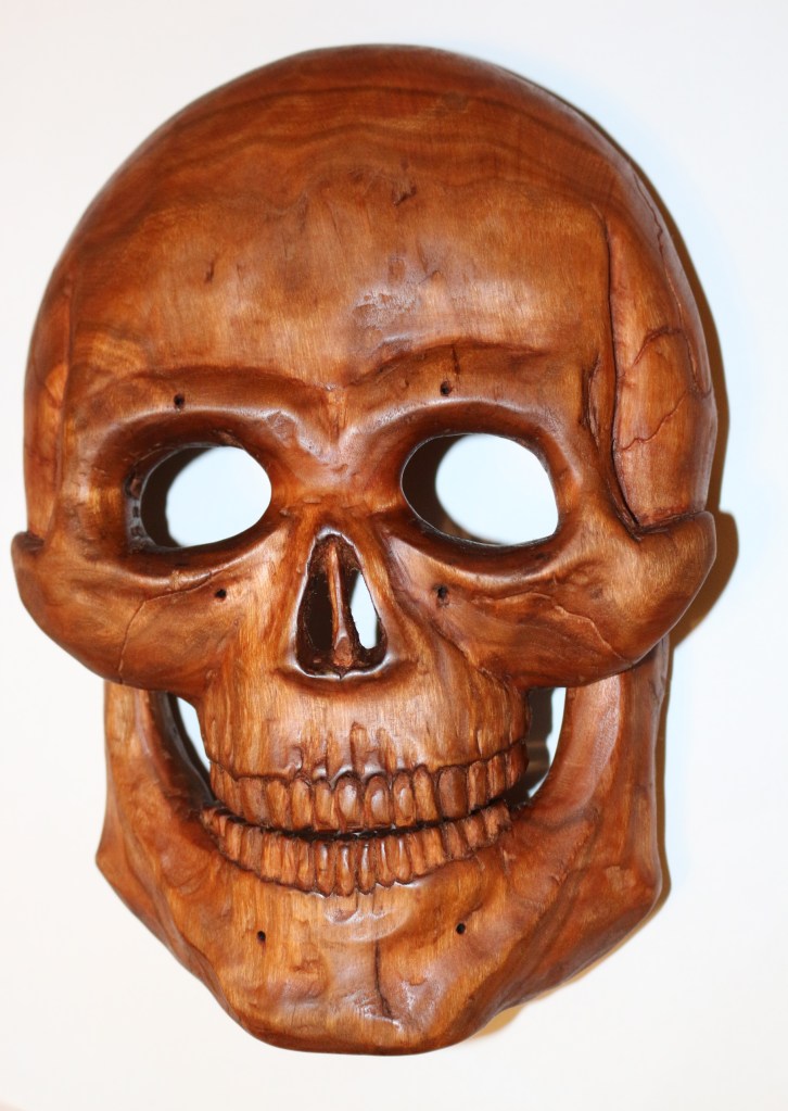 woodcarving carving woodwork relief skull mask shamanism ritual rites skeleton death grim reaper ancestor worship cherry wood paganism folk art gothic sean kelly odinns grove