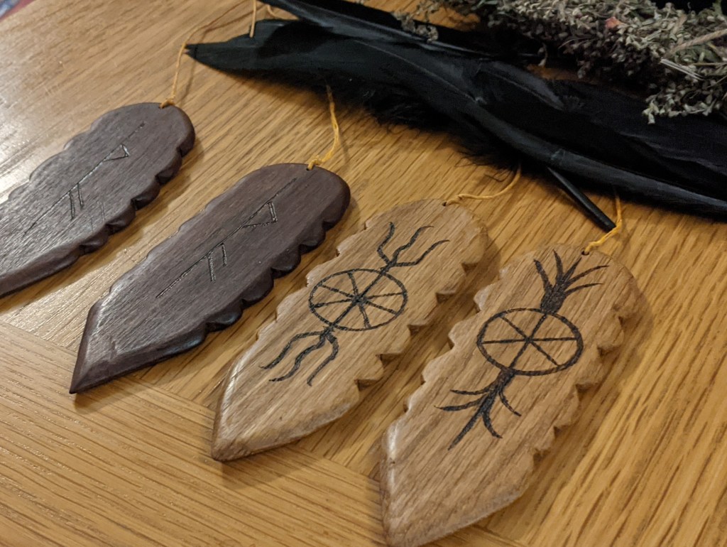 bullroarers bullroarer oak walnut british design tarhun thor taranis storm god binding rune futhark thurisaz jupiter shamanism ritual animism paganism folk instrument primitive woodcarving carving woodwork pyrography sean kelly odinns grove traditional arts crafts