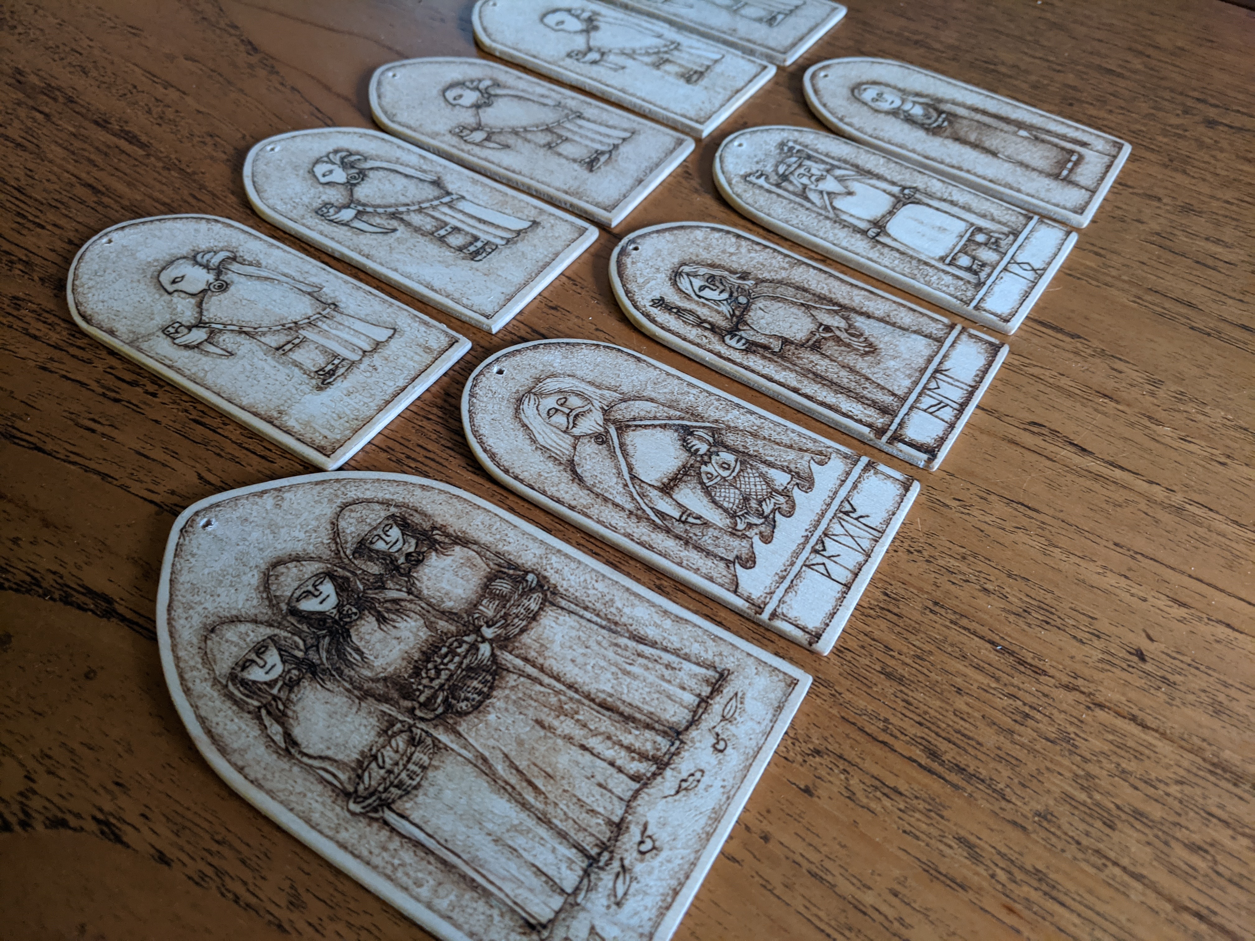 festive tree decorations yule yuletide christmas xmas tree decs featuring valkyries and germanic norse anglo saxon deities paganism pagan art norse viking old english pyrography plywood